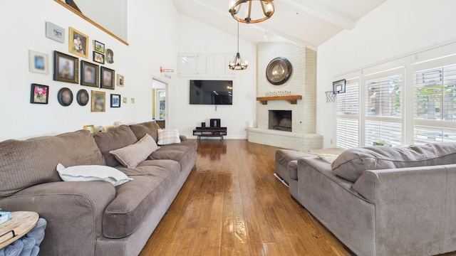 4615 94th St, Lubbock, TX 79424 - living area with high vaulted ceiling, hardwood / wood-style flooring, a chandelier, beam ceiling, and a brick fireplace