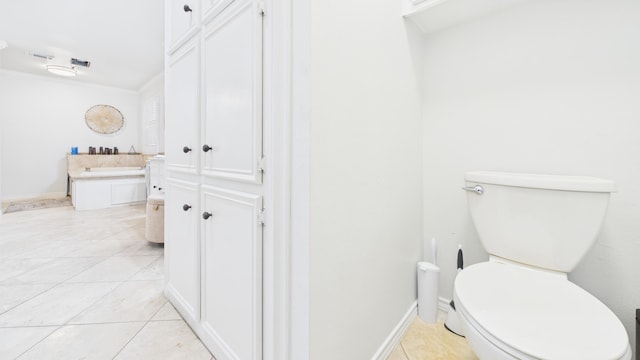 4615 94th St, Lubbock, TX 79424 - bathroom featuring toilet, tile patterned flooring, and crown molding
