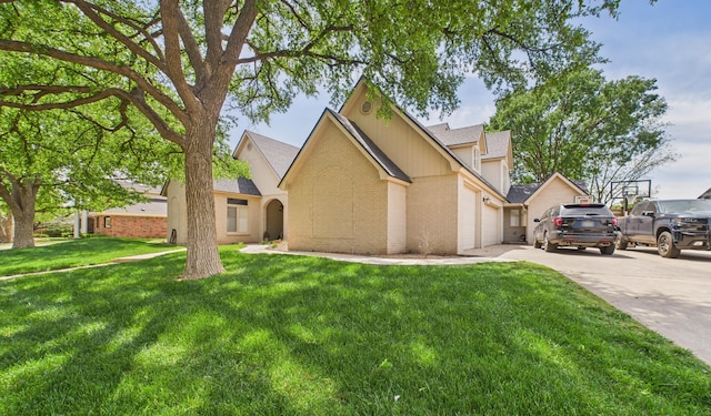 4615 94th St, Lubbock, TX 79424 - view of front of property featuring brick siding, driveway, a front yard, a shingled roof, and an attached garage
