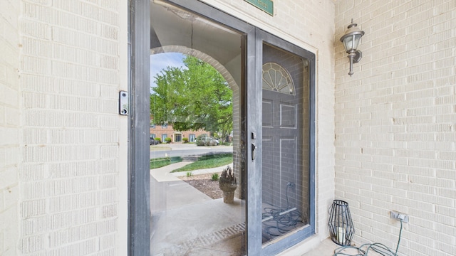 4615 94th St, Lubbock, TX 79424 - view of exterior entry featuring brick siding