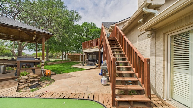 4615 94th St, Lubbock, TX 79424 - view of jungle gym with stairway, a deck, a patio, and fence