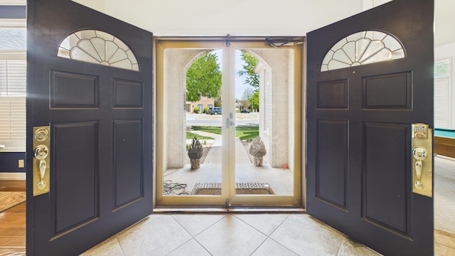 4615 94th St, Lubbock, TX 79424 - foyer entrance with light tile patterned floors and french doors