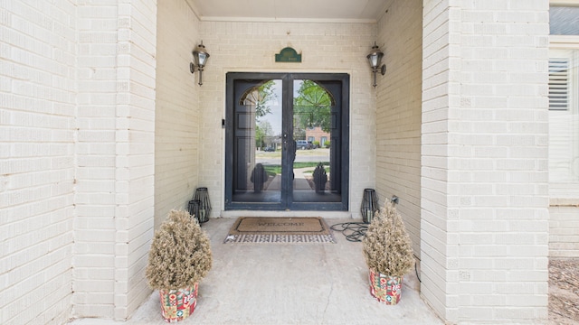4615 94th St, Lubbock, TX 79424 - property entrance featuring french doors and brick siding
