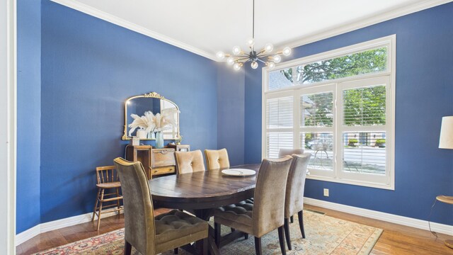 4615 94th St, Lubbock, TX 79424 - dining area featuring a chandelier, baseboards, ornamental molding, and wood finished floors