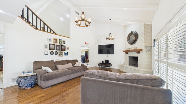 4615 94th St, Lubbock, TX 79424 - living area featuring a chandelier, high vaulted ceiling, wood-type flooring, beam ceiling, and a fireplace