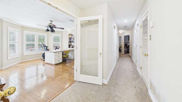 4615 94th St, Lubbock, TX 79424 - hallway featuring an office area, baseboards, light wood-style flooring, recessed lighting, and ornamental molding