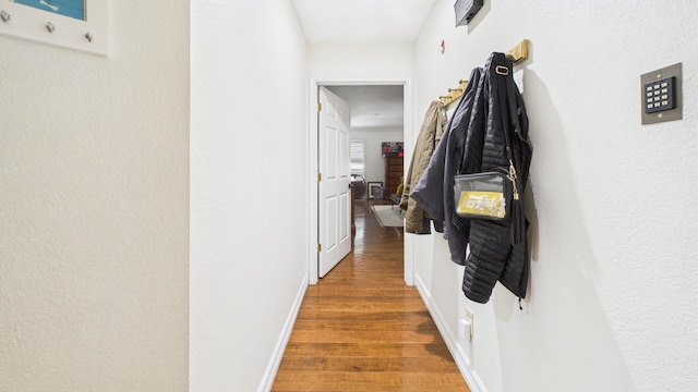 4615 94th St, Lubbock, TX 79424 - hallway featuring wood finished floors and baseboards