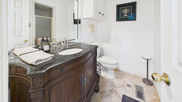 4615 94th St, Lubbock, TX 79424 - full bath with toilet, a shower stall, baseboards, and vanity