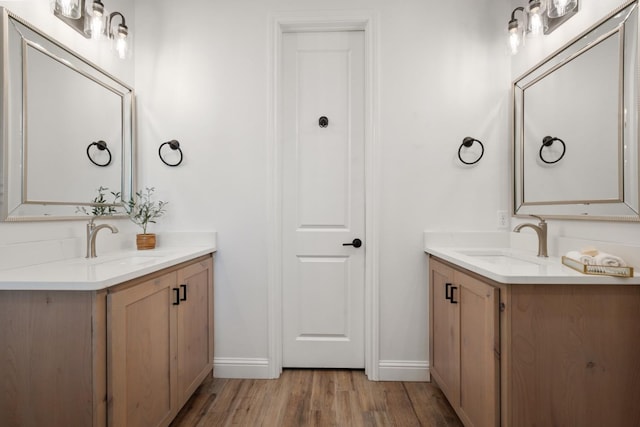 bathroom featuring hardwood / wood-style flooring and vanity