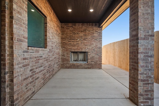 view of patio / terrace with an outdoor brick fireplace