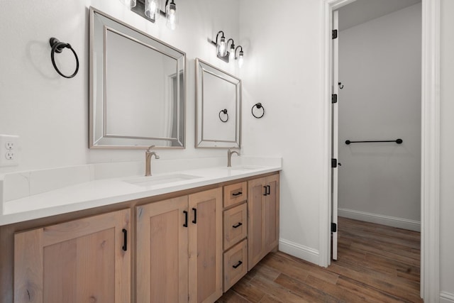 bathroom featuring wood-type flooring and vanity