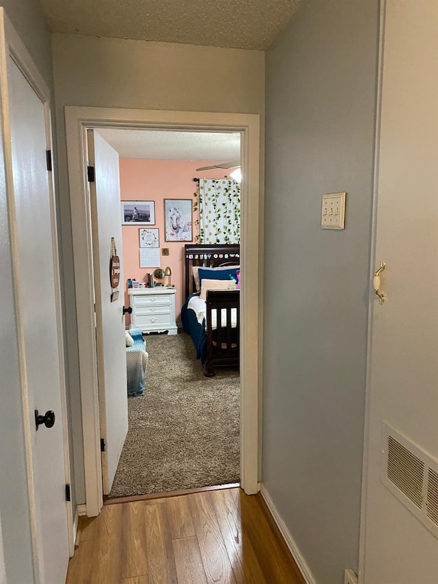 carpeted bedroom with a closet and ceiling fan