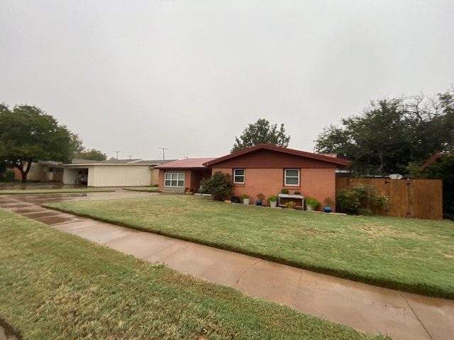 single story home with a front yard