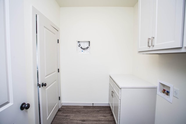 laundry area with cabinets, dark hardwood / wood-style floors, and hookup for a washing machine