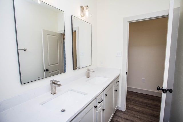 bathroom with vanity and hardwood / wood-style floors