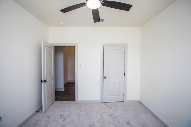 unfurnished bedroom with ceiling fan and light carpet