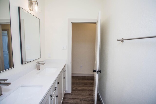 bathroom with vanity and hardwood / wood-style floors