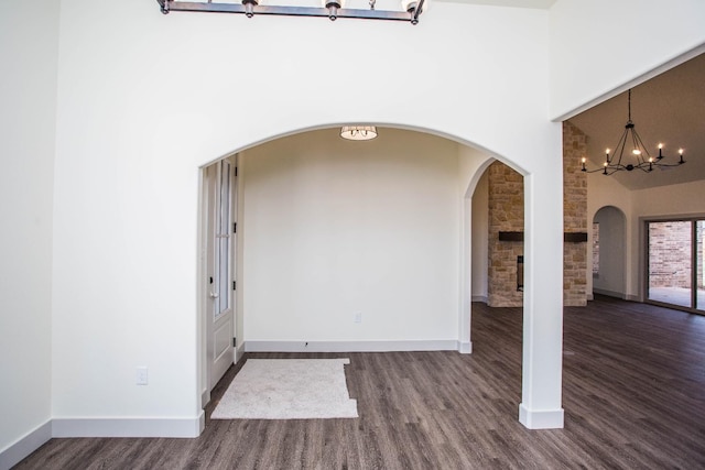 foyer featuring dark hardwood / wood-style floors and a high ceiling