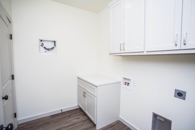 laundry area featuring cabinets, washer hookup, hookup for an electric dryer, and dark hardwood / wood-style flooring