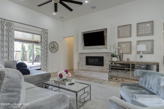 11604 Uxbridge Ave, Lubbock, TX 79424 - living area with ceiling fan, wood finished floors, a glass covered fireplace, and recessed lighting