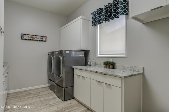 11604 Uxbridge Ave, Lubbock, TX 79424 - laundry area with independent washer and dryer, cabinet space, and light wood-style floors