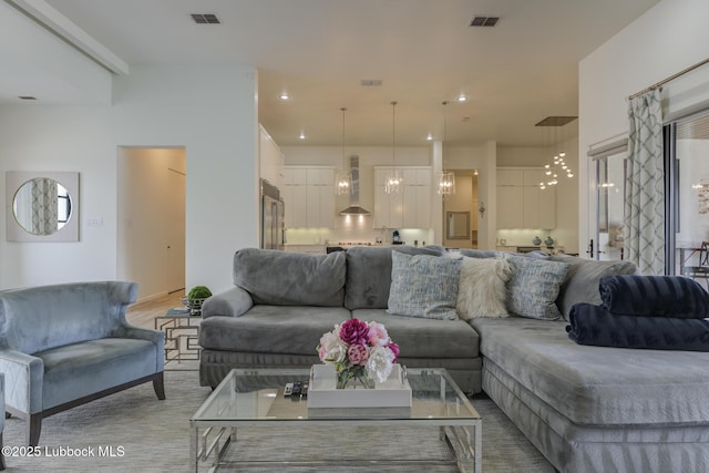 11604 Uxbridge Ave, Lubbock, TX 79424 - living area featuring a chandelier