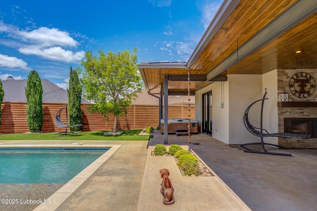 11604 Uxbridge Ave, Lubbock, TX 79424 - view of pool with a hot tub, a patio, and a fenced backyard