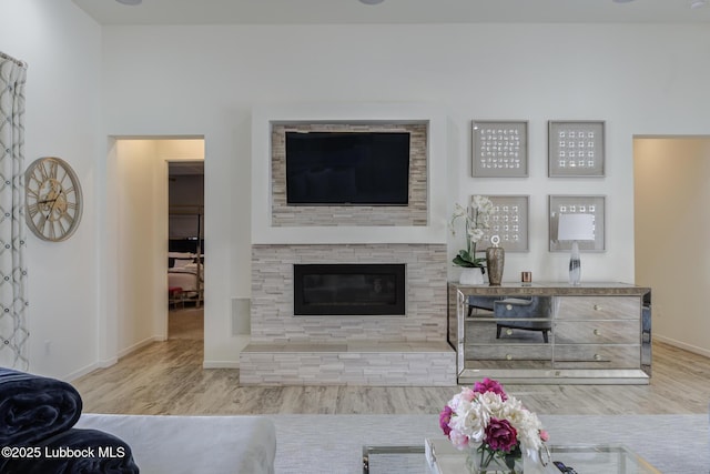 11604 Uxbridge Ave, Lubbock, TX 79424 - living area with wood finished floors and a fireplace