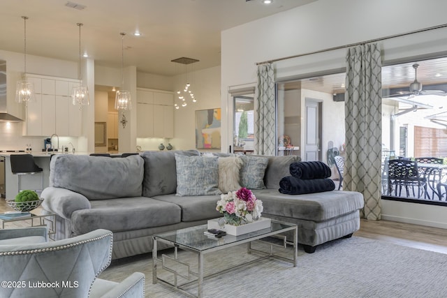 11604 Uxbridge Ave, Lubbock, TX 79424 - living room featuring light wood-style flooring