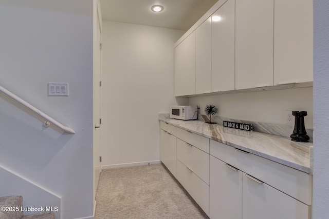 11604 Uxbridge Ave, Lubbock, TX 79424 - bar area with white microwave, light carpet, and recessed lighting