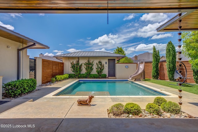 11604 Uxbridge Ave, Lubbock, TX 79424 - view of pool featuring a water slide, a fenced backyard, and a patio