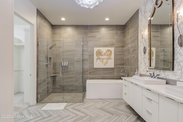 11604 Uxbridge Ave, Lubbock, TX 79424 - bathroom featuring a tub, double vanity, a shower stall, and recessed lighting
