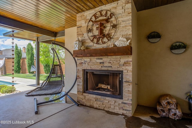 11604 Uxbridge Ave, Lubbock, TX 79424 - view of patio / terrace with an outdoor stone fireplace