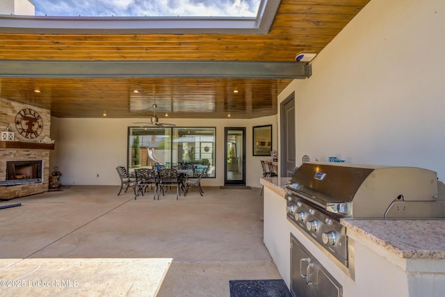 11604 Uxbridge Ave, Lubbock, TX 79424 - view of patio / terrace with an outdoor stone fireplace, an outdoor kitchen, and outdoor dining area