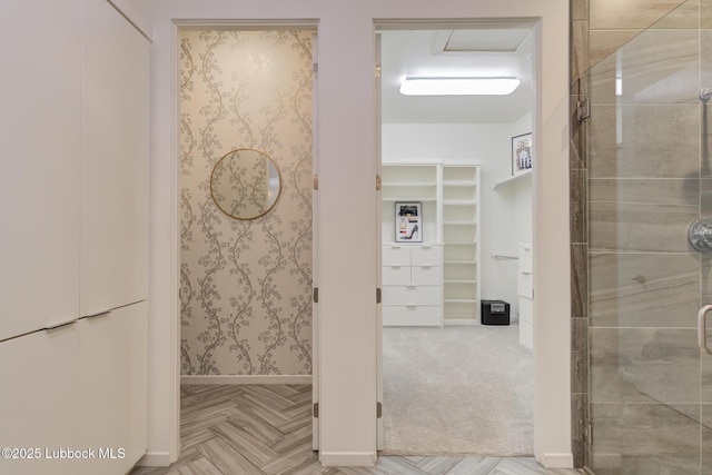 11604 Uxbridge Ave, Lubbock, TX 79424 - bathroom featuring a spacious closet, a stall shower, and wallpapered walls