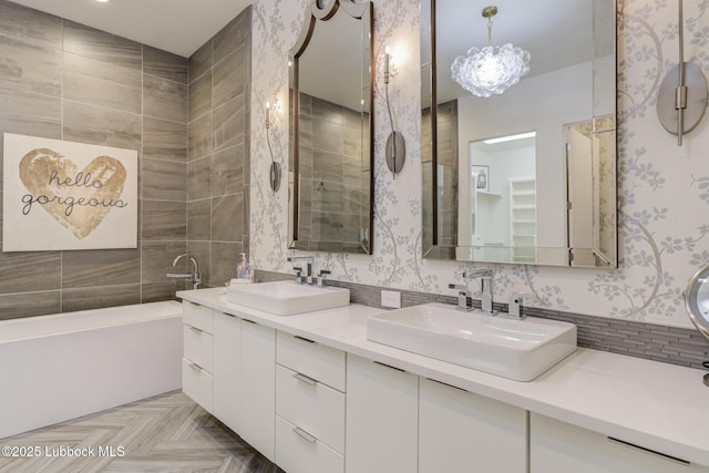 11604 Uxbridge Ave, Lubbock, TX 79424 - bathroom with a garden tub, double vanity, and wallpapered walls