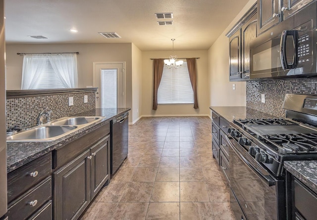 kitchen with dark brown cabinetry, decorative light fixtures, sink, and black appliances