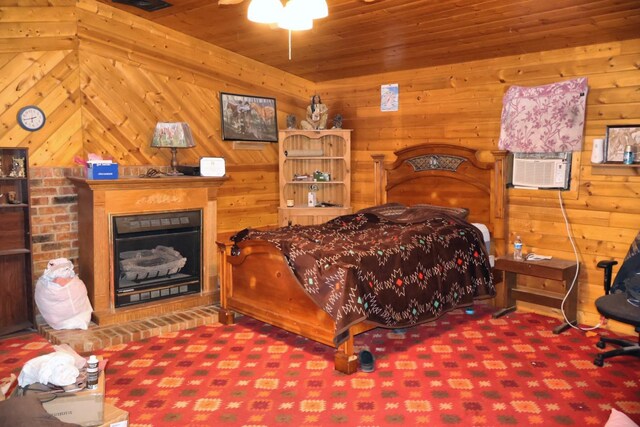 bedroom featuring wooden walls, wooden ceiling, and carpet flooring