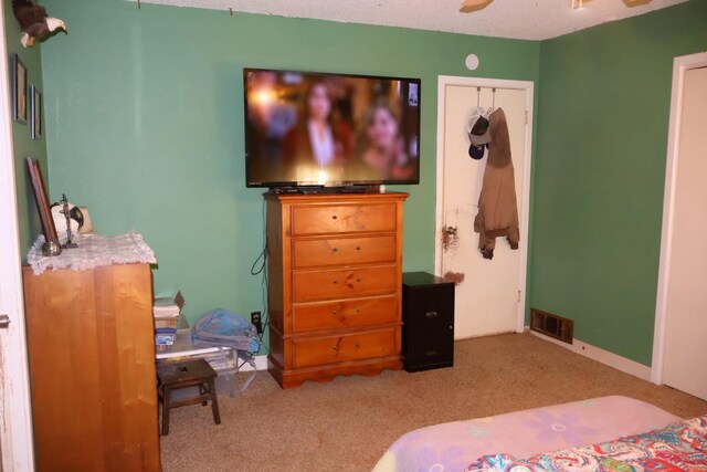 bedroom featuring light colored carpet