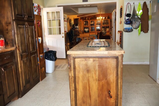 kitchen featuring dark brown cabinetry and a center island