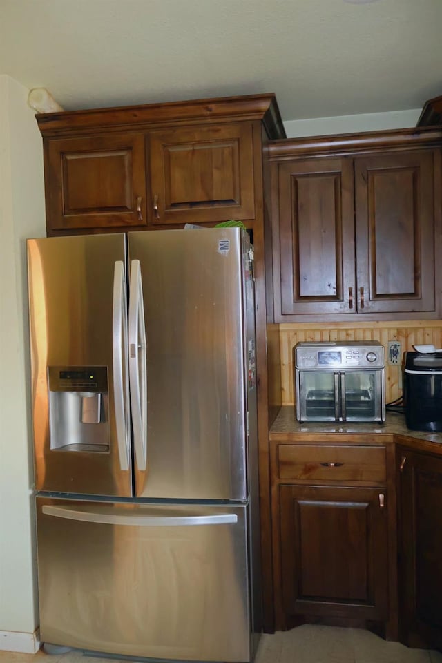 kitchen featuring stainless steel fridge with ice dispenser