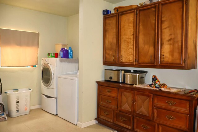 laundry area with washing machine and dryer