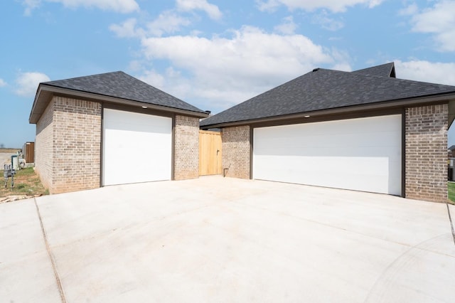 exterior space with an outbuilding and a garage