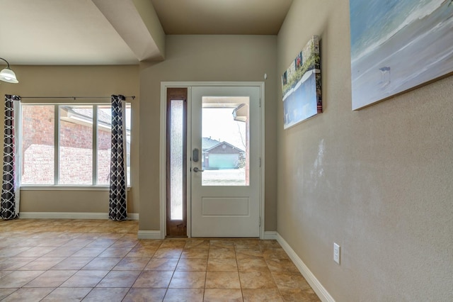 entrance foyer with light tile patterned floors