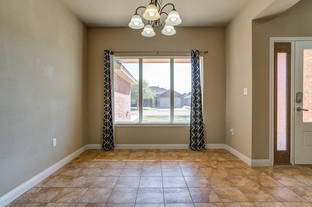 interior space featuring light tile patterned floors and a chandelier