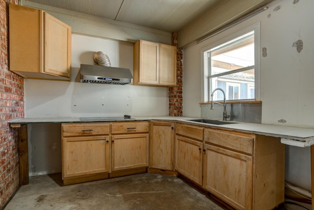 kitchen featuring extractor fan, brick wall, light brown cabinetry, sink, and black electric cooktop