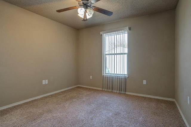 carpeted empty room with a textured ceiling and ceiling fan