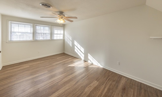 empty room featuring hardwood / wood-style floors and ceiling fan