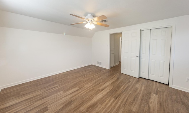 unfurnished bedroom featuring ceiling fan, lofted ceiling, and hardwood / wood-style floors