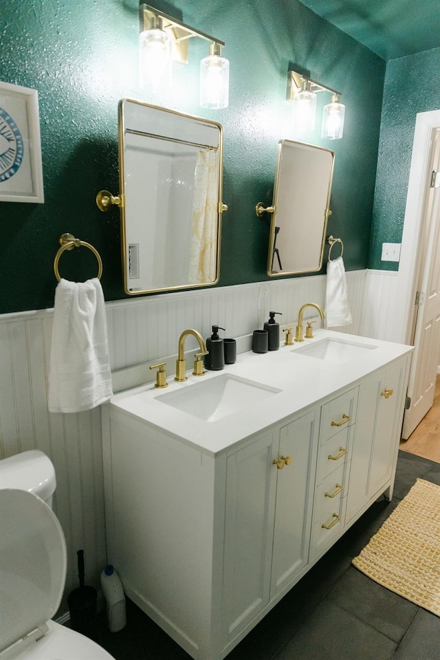 bathroom with vanity and toilet